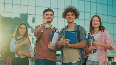 Portrait of Group Students Showing Thumbs Up at Background of High School Stock Footage 241443661