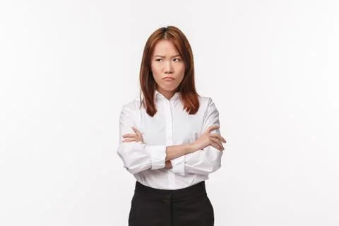 Portrait of grumpy and offended young asian woman, cross hands on chest Stock Photos