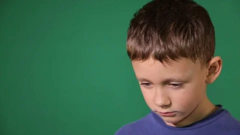 Portrait of the guilty boy, on a green background Stock Footage 84680109