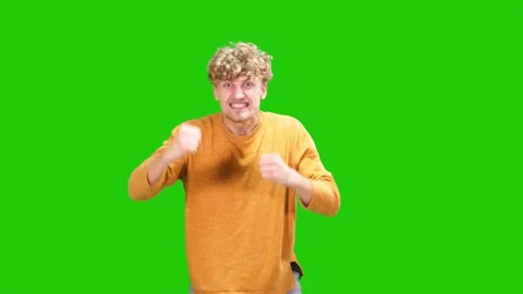 Portrait of guy is happy to win on green screen.crazy win Stock Footage 170312785