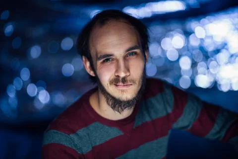 Portrait of a guy in a hat on a blurred background Stock Photos