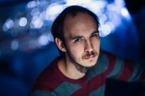 Portrait of a guy in a hat on a blurred background Stock Photos