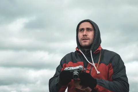 Portrait of a guy with an old camera in his hands Stock Photos