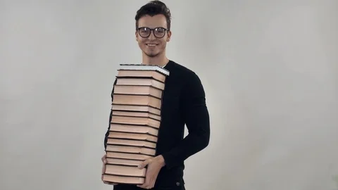 Portrait guy with pile of books Stock Footage 81802038