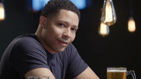 Portrait of a guy sitting at a bar Stock Footage 62937439