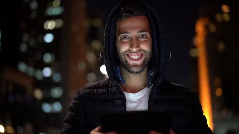 Portrait of a Guy using tablet at night Stock Footage 89729420