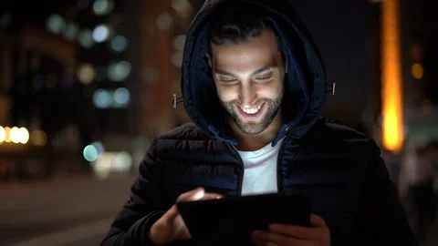 Portrait of a Guy using tablet at night Stock Footage 89729454