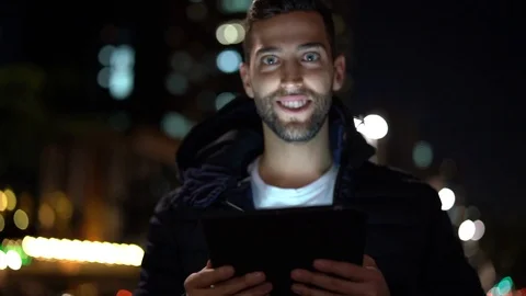 Portrait of a Guy using tablet at night Stock Footage 89729505