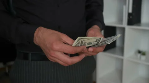 Portrait of hands of a young office worker who counts money. Success. Salary Stock Footage 133570859