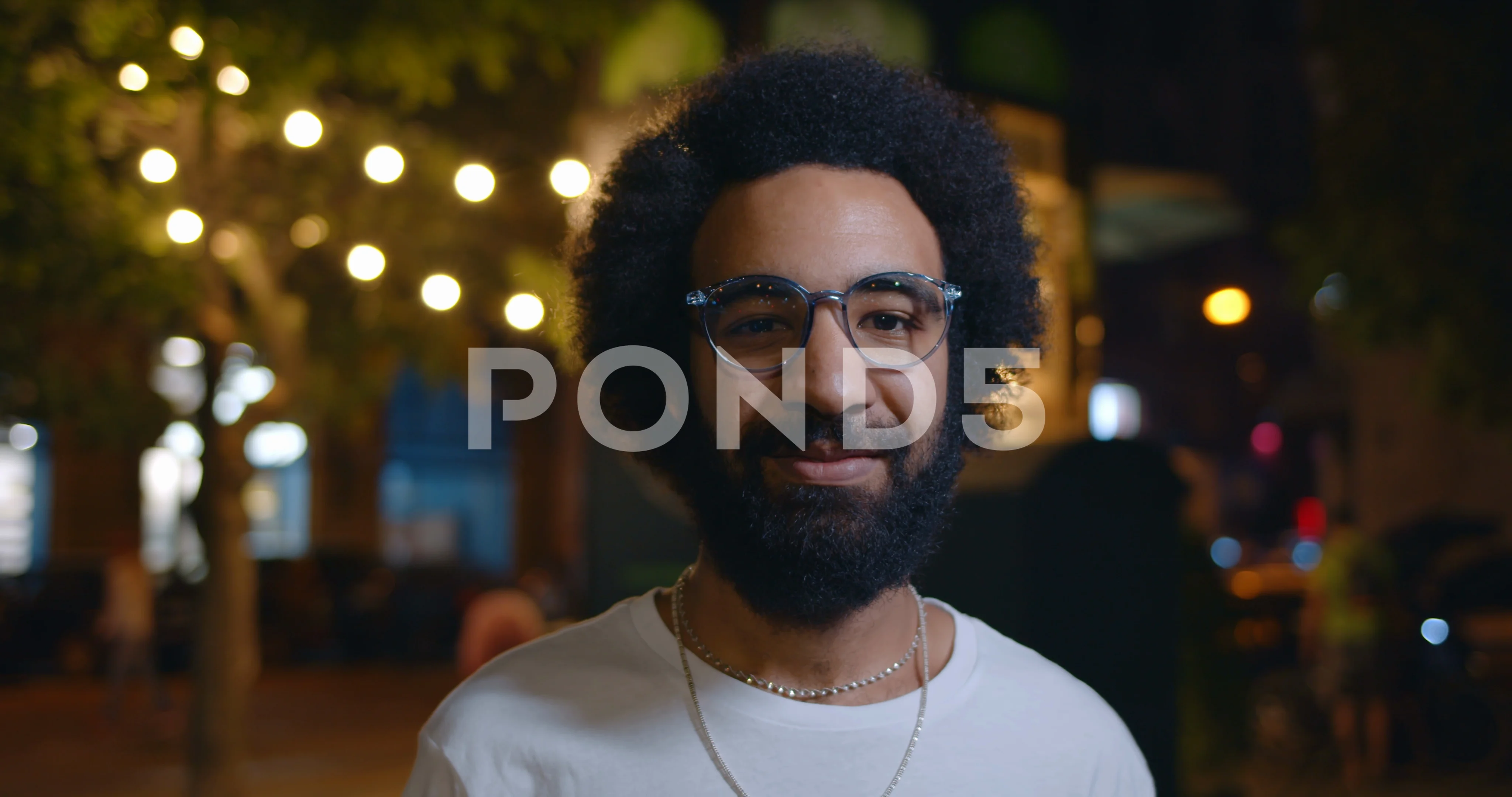 Portrait of handsome arab man in glasses looking to camera. Close up view of