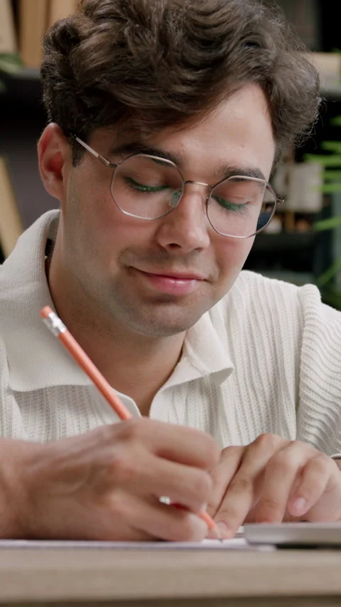 Portrait of a handsome authentic student in a stylish office, using a laptop at Video stock 316606021