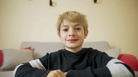 Portrait of handsome boy looking to camera and talking Stock Footage 231708376