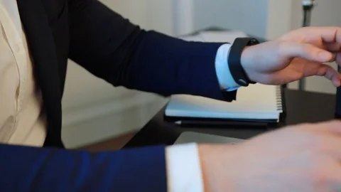 Portrait of handsome business man in suit using laptop computer in the office Stock Footage