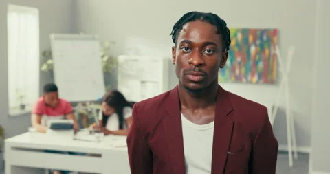 Portrait of a handsome elegant man with dreadlocks and stubble, dark complexion Stock Footage 163706208