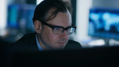 Portrait of the Handsome Expert wearing Glasses Working on a Computer. Stock Footage