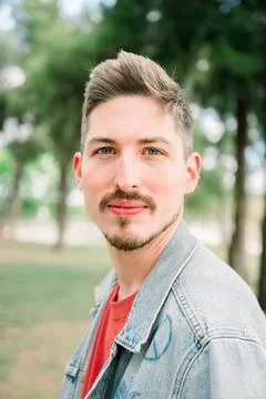Portrait of handsome guy looking at camera Stock Photos