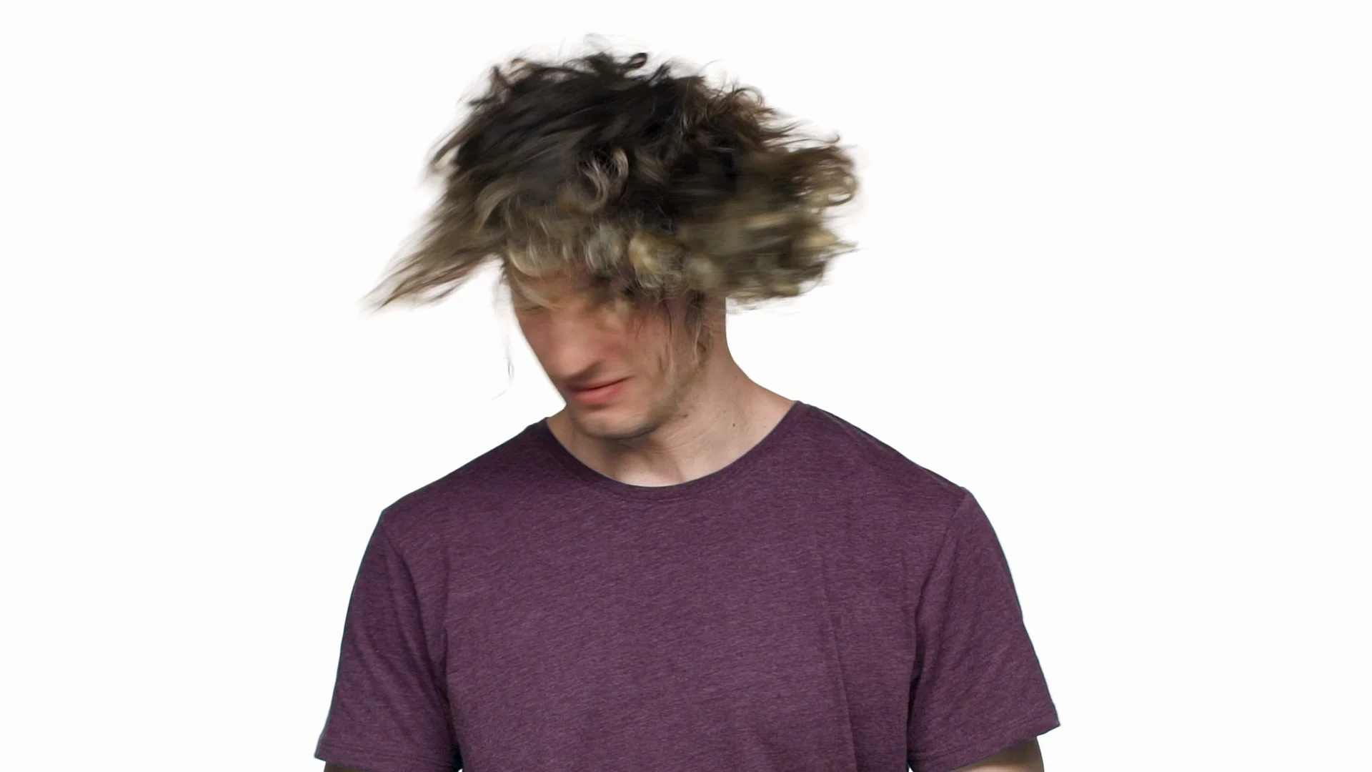 Portrait of handsome hairy man in casual t-shirt smiling and shaking his  curly