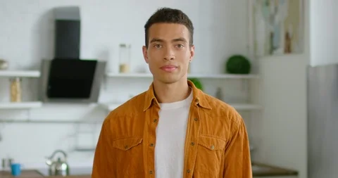 Portrait of handsome Hispanic man in kitchen Stock Footage 114641278