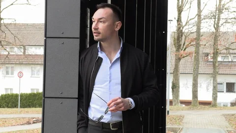 Portrait of a handsome man in a black jacket, closeup Stock Footage 126557445