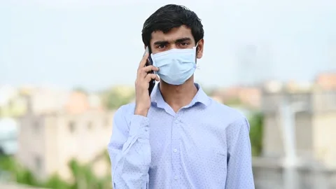 Portrait handsome man having phone talk outdoor during corona virus pandemic. Stock Footage 133299569