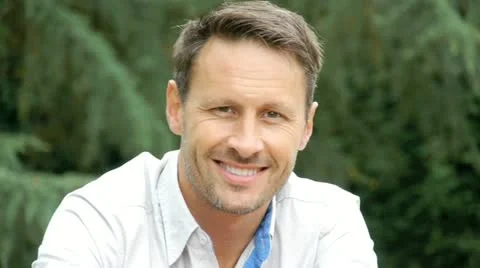 Portrait of handsome man looking at camera Stock Footage