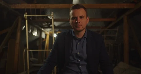 Portrait of handsome man looking at the camera in  dark area room , cinematic mo Stock Footage 118825229