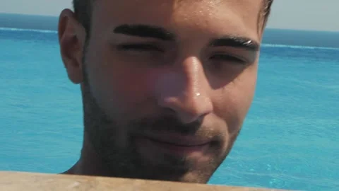 Portrait of a handsome man in the pool, Close up Video stock 141071823
