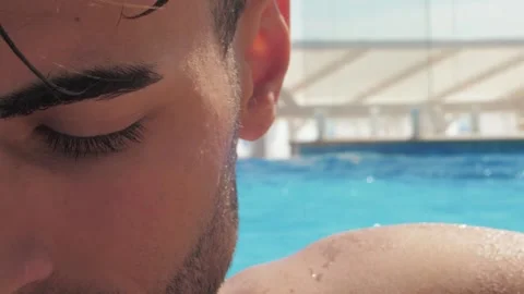 Portrait of a handsome man in the pool, Close up Stock Footage 142757931