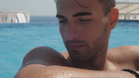 Portrait of a handsome man in the pool, Close up Stock Footage 145080256