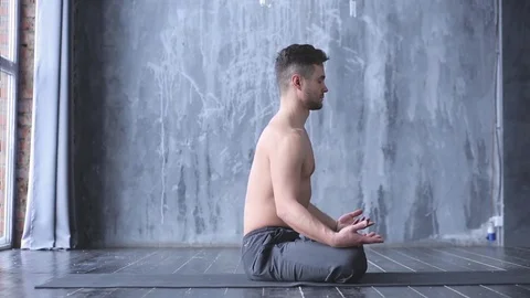 Portrait of a handsome man practicing meditation and yoga Stock Footage 71240009
