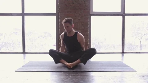 Portrait of a handsome man practicing meditation and yoga Stock Footage 71241151