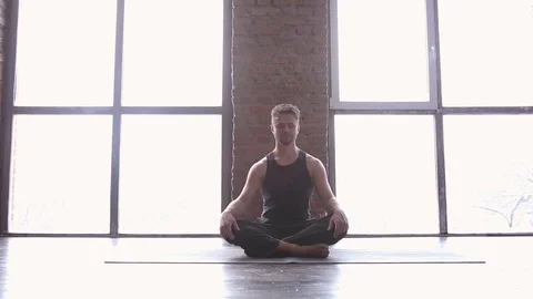 Portrait of a handsome man practicing meditation and yoga Stock Footage 71241957