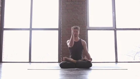 Portrait of a handsome man practicing meditation and yoga Stock Footage 71241973