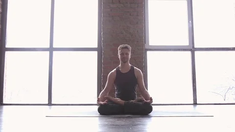 Portrait of a handsome man practicing meditation and yoga Stock Footage 71242050