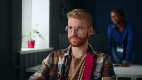 Portrait of handsome man programmer in IT company office, guy with glasses work Stock Footage 233731173