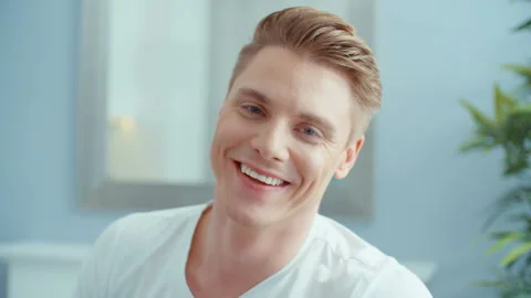 Portrait of handsome man smiling to a camera, indoors. 動画素材 86720068