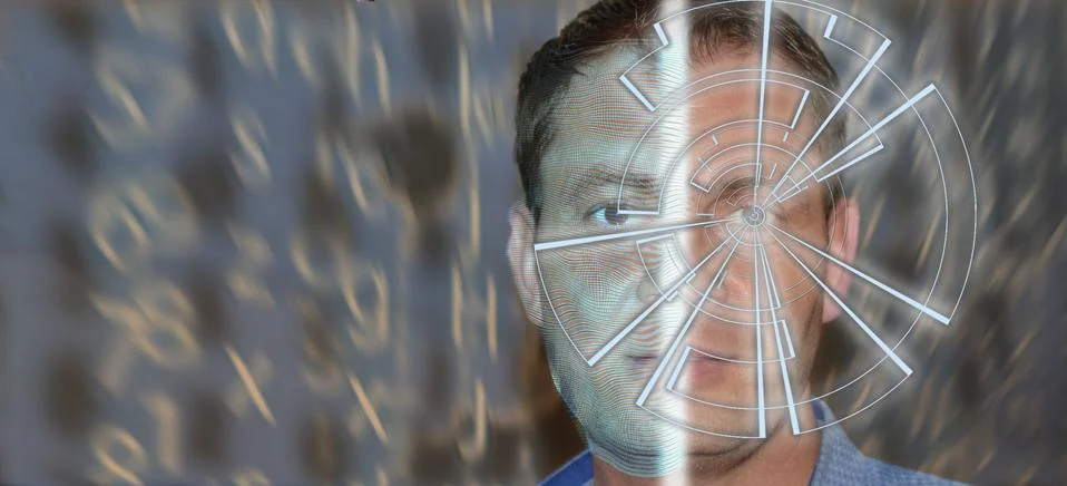 Portrait of handsome man with tech pattern on eye and wireframe on the half o Stock Photos