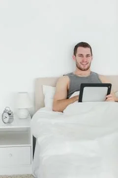 Portrait of a handsome man using a tablet computer 写真素材