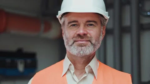 Portrait of handsome mature engineer posing on background of plastic pipes Stock-Footage 255012433
