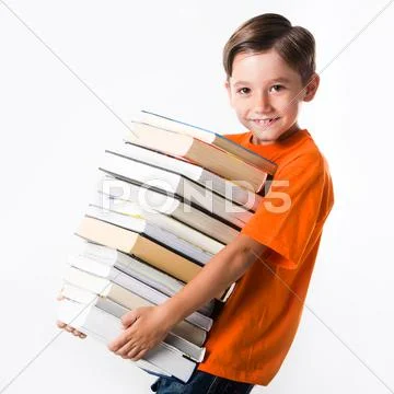 Portrait of handsome pupil with huge pile of books looking at camera Stock Photos