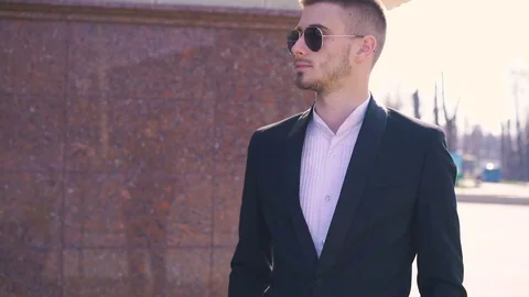 Portrait of handsome serious macho looking aside in sunglasses in 4K 動画素材 74192655
