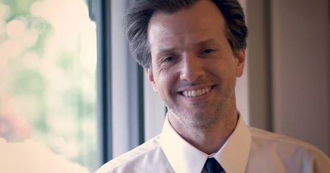 Portrait of handsome smiling middle aged man wearing a tie Stock Footage 82274979