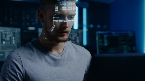 Portrait of Handsome Software Developer Working on Computer in Digital Identity Stock Footage 103574754