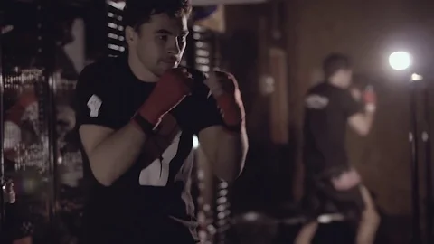 Portrait of handsome strong man training some boxing techniques. Stock-Footage 76913321
