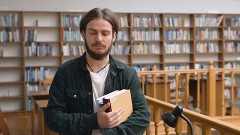 Portrait of Handsome Student in Library Видео 81516854