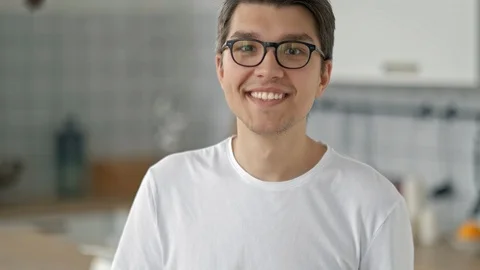 Portrait of a Handsome Young Bearded Guy Looking at the Camera with a Happy Stock Footage 97561994