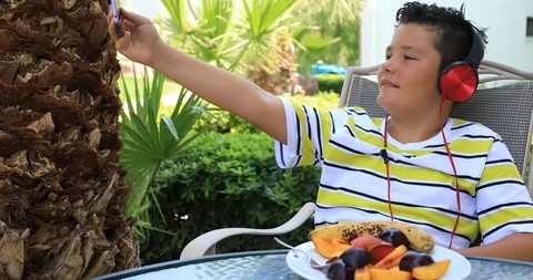 Portrait of a handsome young boy taking selfie Stock Footage 94544940