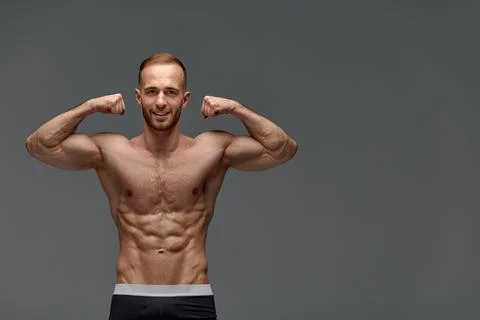 Portrait of a handsome young guy model a shirtless with a muscular healthy body Stock Photos