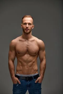 Portrait of a handsome young guy model a shirtless with a muscular healthy body Stock Photos