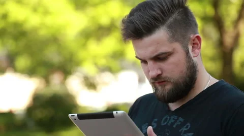 Portrait of a handsome young man working with a tablet Stock Footage 50981642